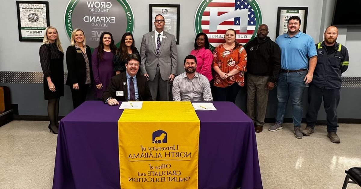 University of North Alabama representatives as well as those from the Nucor facility in Decatur participate in a signing ceremony for a learning agreement that will benefit Nucor team members.
